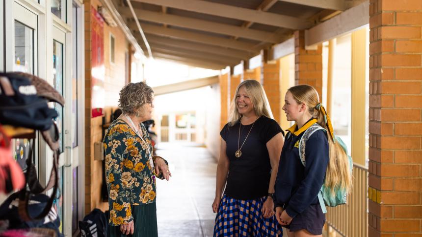Teacher talking to parent and student